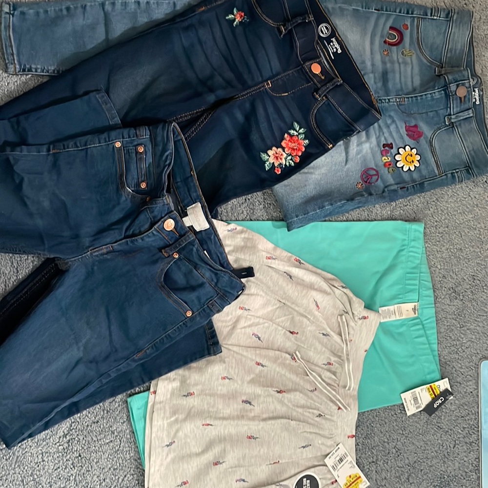 Girls size 7: 3 pairs jeans, 1 crop pants, 1 skort.